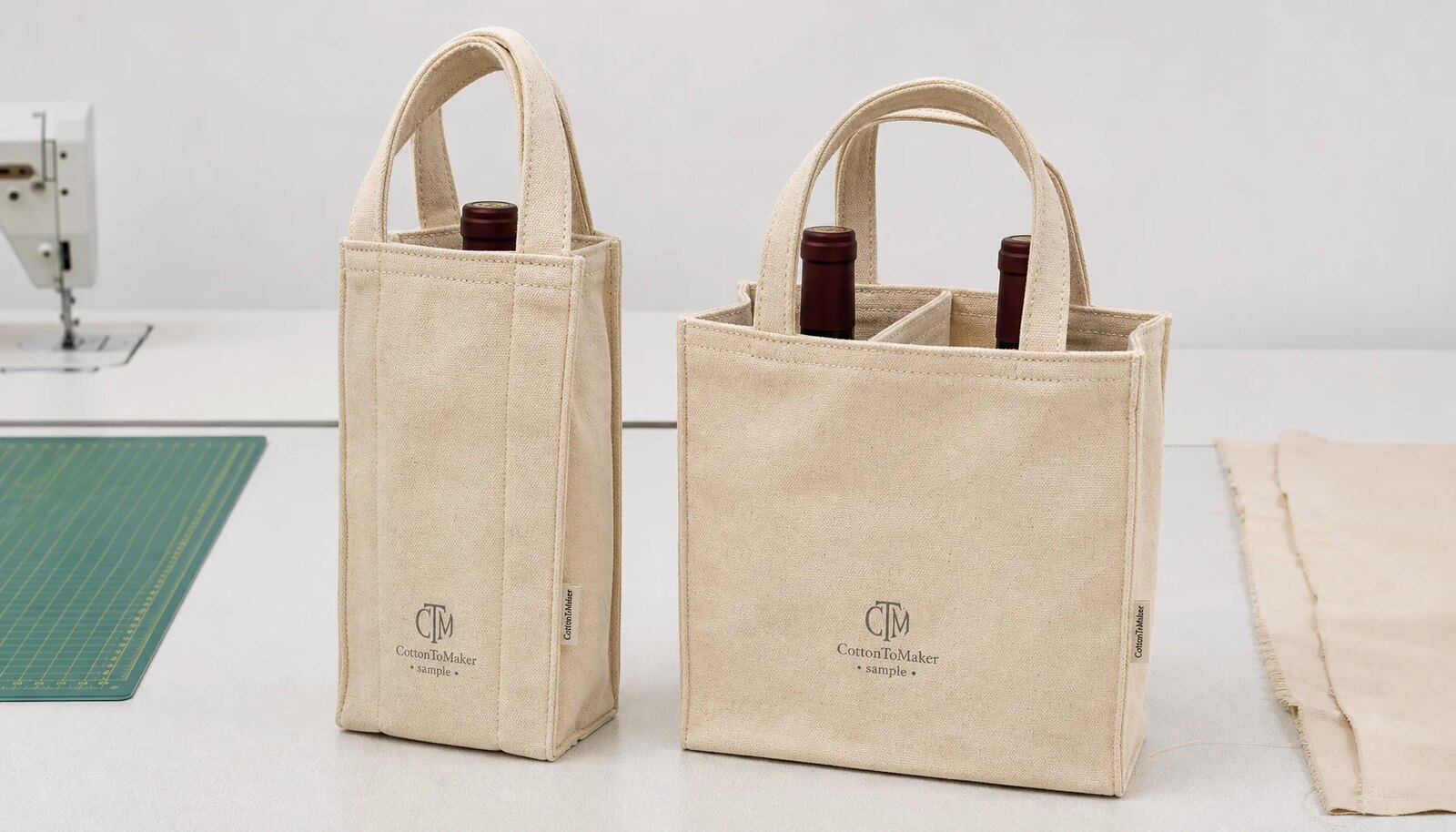 Natural canvas wine carriers with CTM sample logo, reinforced handles, and stitched dividers in a clean studio sample room