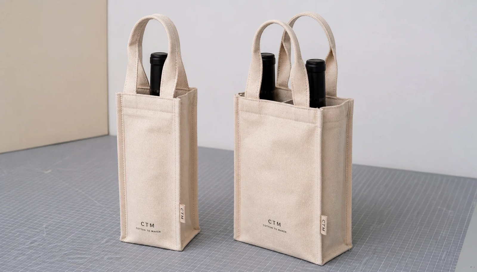 Natural canvas wine carriers with CTM sample logo and reinforced handles