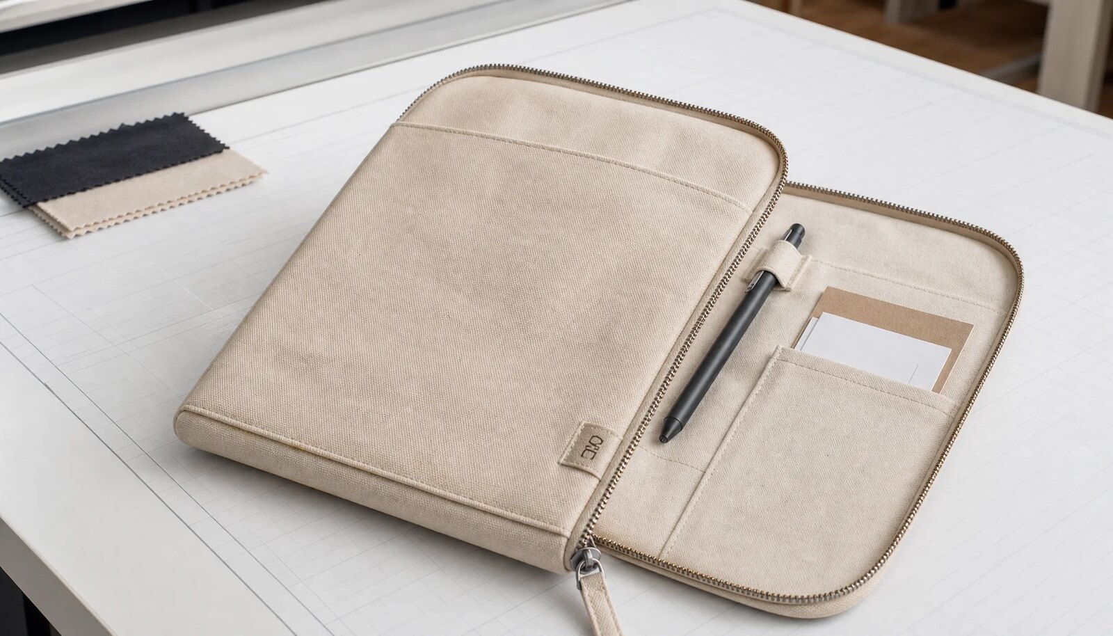 Canvas zipper portfolio with a simple CTM CottonToMaker logo shown in a clean factory sample room