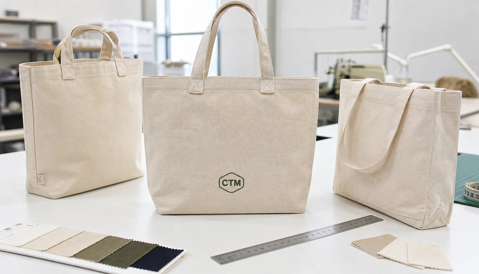 Custom canvas grocery totes with CTM sample logo, reinforced handles, and fabric swatches for hotel retail material selection