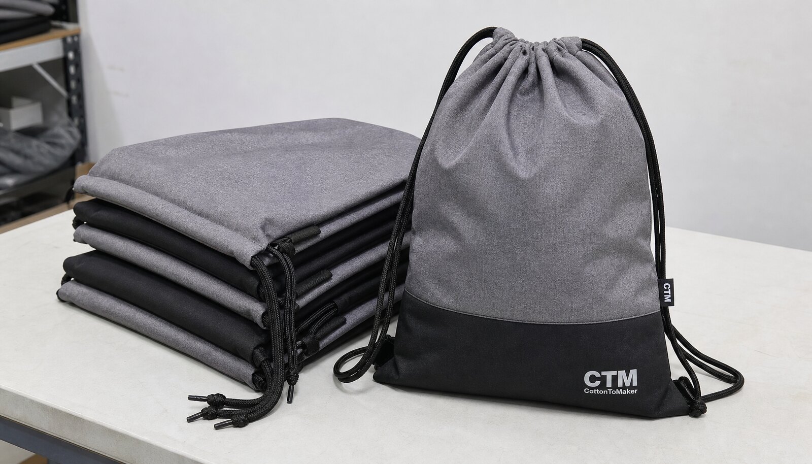 Wholesale drawstring sport pack with a small CTM CottonToMaker logo printed on the front in a clean factory sample room