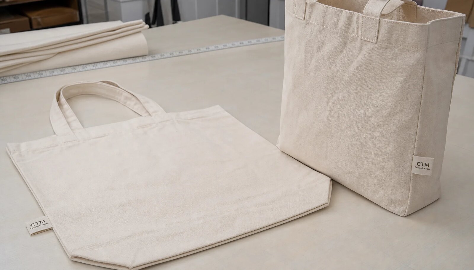 Organic cotton tote with a CTM CottonToMaker sewn side label in a factory sample room