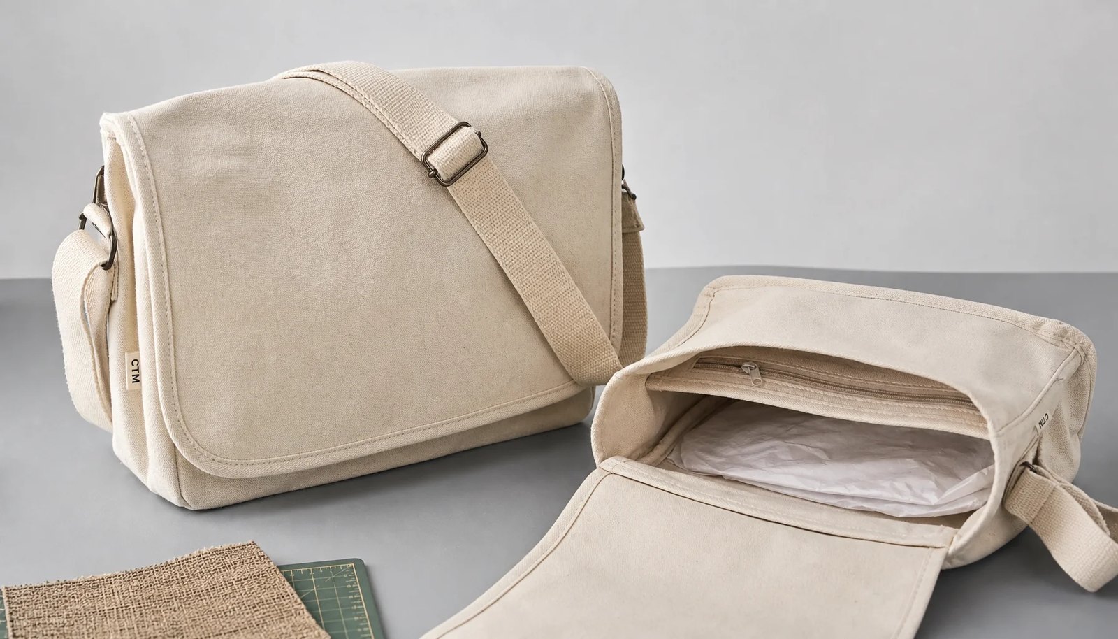 Natural canvas messenger bag sample with CTM woven side label and adjustable strap