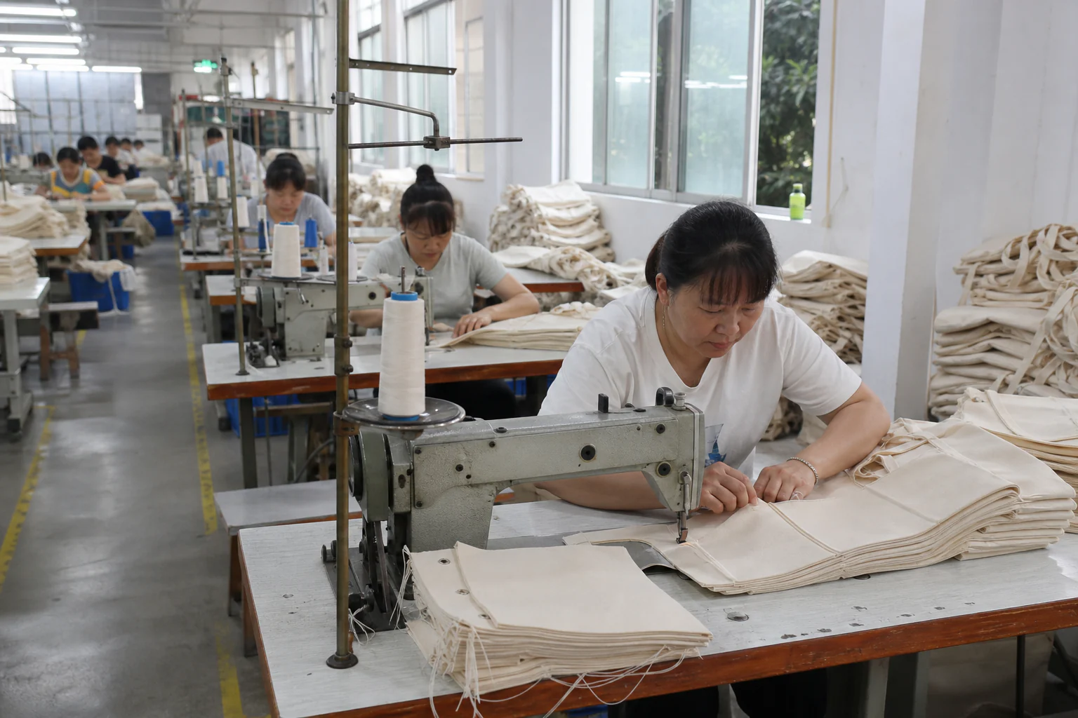 Canvas bag sewing line inside the manufacturing facility
